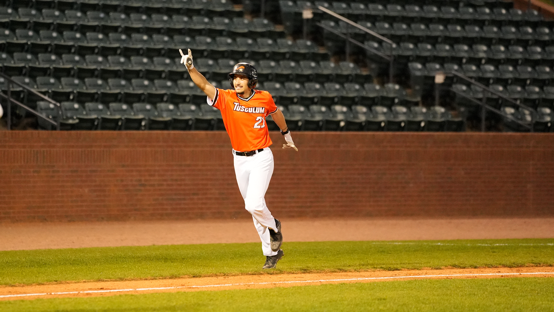 Ryan Ortega celebrating his first collegiate home run in Tusculum's 8-2 win over Emory & Henry (photo by Joe Yates)