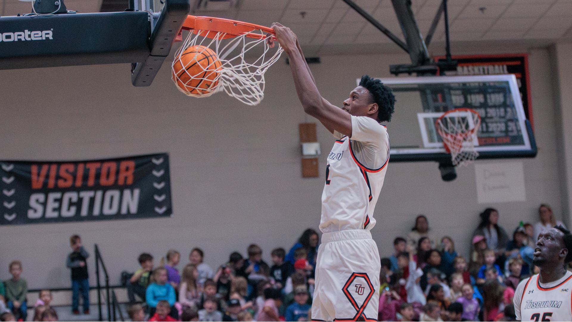 TJ Printup with one of Tusculum's 12 dunks in Tuesday's 127-72 win over The Crown College (photo by Kari Ham)