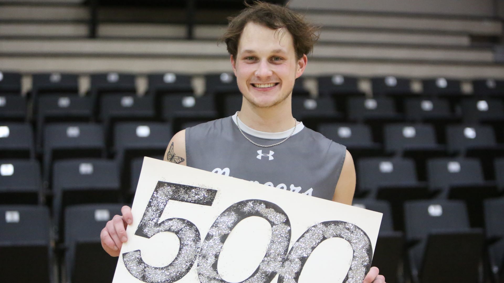 player holding a sign with the number 500