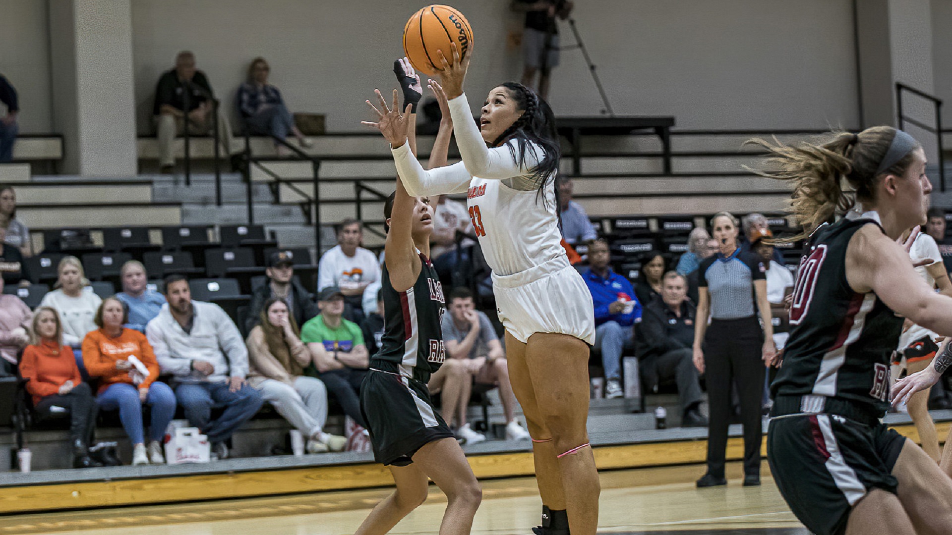 Jami Tham finished with 25 points and 11 rebounds for her 26th double-double of the season (photo by Chuck Williams)
